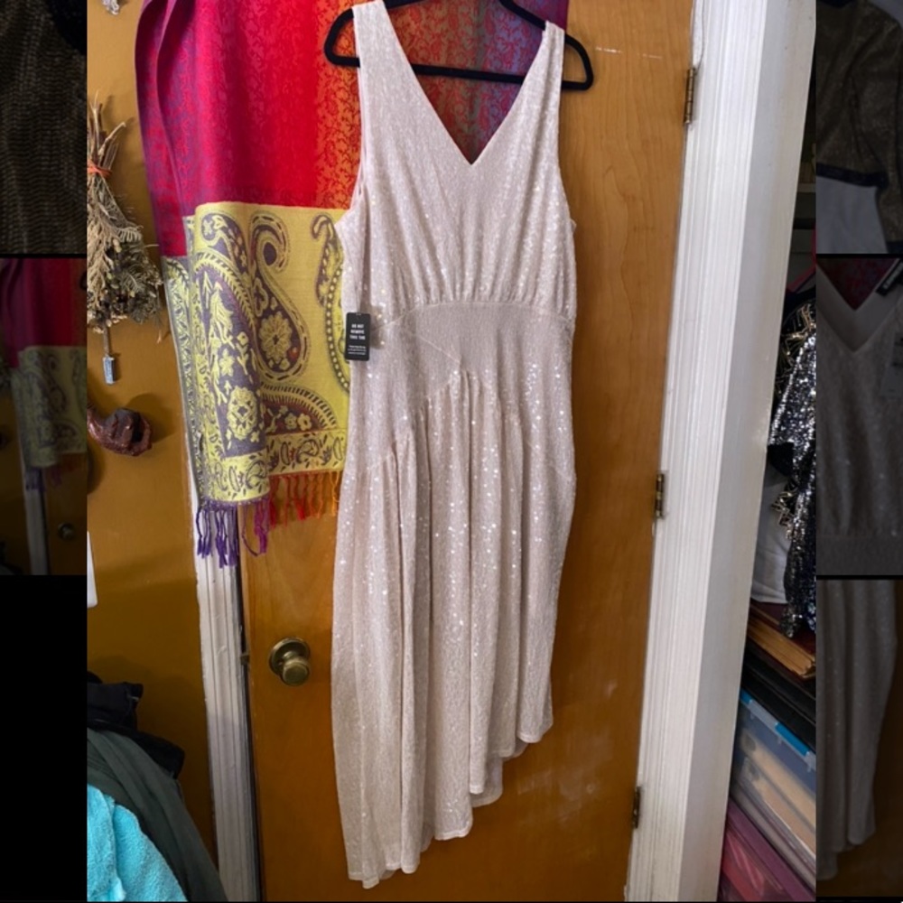 Express sequin midi dress. Tank sleeves and asymmetrical hem. Ivory/cream.
